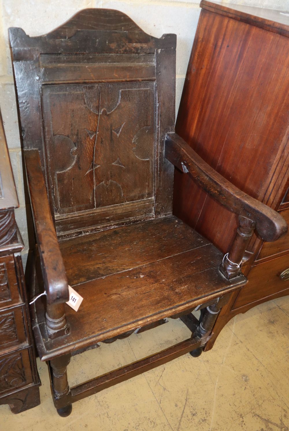 An 18th century and later oak Wainscot armchair, W.64cm, D.56cm, H.110cm